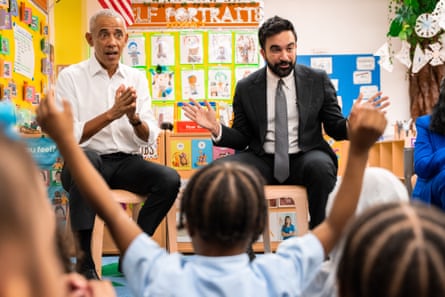 Men read to children in classroom