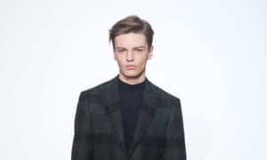 A Raf simons model sporting a wet-look parting in 2010.