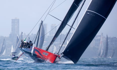 Andoo Comanche sails through Sydney Harbour during the start of the Sydney to Hobart yacht