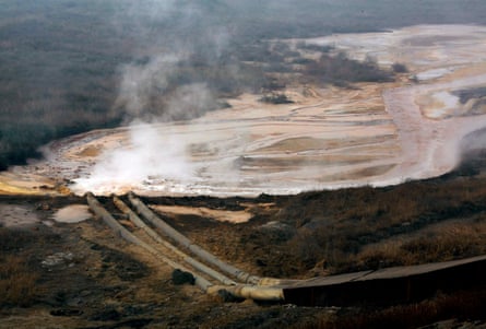 Pipes coming from a rare earth smelting plant spew polluted water into a vast tailings dam near Xinguang Village, located on the outskirts of the city of Baotou in China’s Inner Mongolia Autonomous Region in 2010.