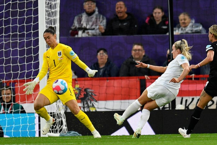 Austria’s goalkeeper Manuela Zinsberger denies England’s striker Lauren Hemp.
