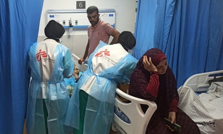 MSF staff treat a young patient at al-Shifa hospital