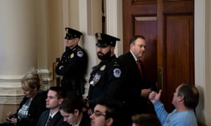 An audience member gives Lee Zeldin a thumbs-up as he leaves the room during a public hearing in the impeachment inquiry.