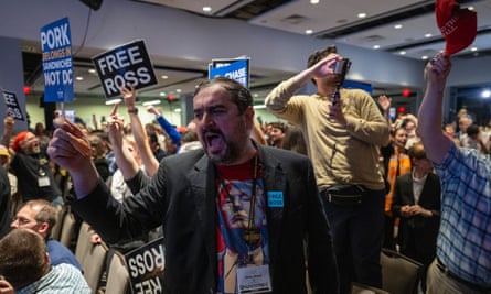 A Libertarian party member shouts protests as Republican presidential candidate Donald Trump addresses the Libertarian National Convention in Washington.