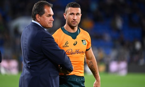 Wallabies coach Dave Rennie shakes hands with Quade Cooper