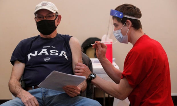 A man receives his first dose of Pfizer’s coronavirus vaccine in Valley Stream, New York on 23 February 2021.
