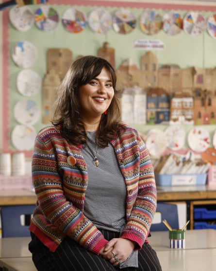 The teacher Jasmine Pert sitting on a desk