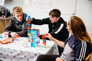 Jordan Ellis (left) Jaryn Taylor (centre) and Maryanne play games on a tea break.