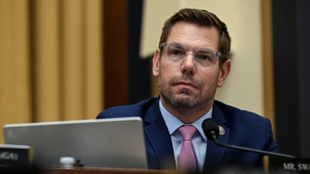 Eric Swalwell successful bluish suit sitting astatine a table successful Capitol Hill.