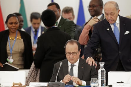 French president Francois Hollande, centre, with foreign minister Laurent Fabius at the COP21 conference in Le Bourget, Paris.
