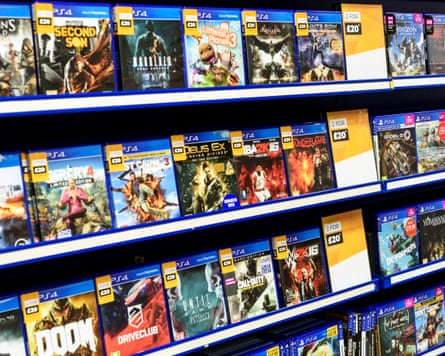 Rows of PS4 video games for consoles on display in a Game Store shop in Essex, England.