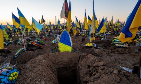 Ukrainian flags are seen on the graves of soldiers at a Khrakiv cemetery on 24 January 2023. Nearly one year after Russian President Vladimir Putin invaded neighboring Ukraine, both countries are engaged in a fierce battle for control of areas throughout eastern and southern Ukraine. 