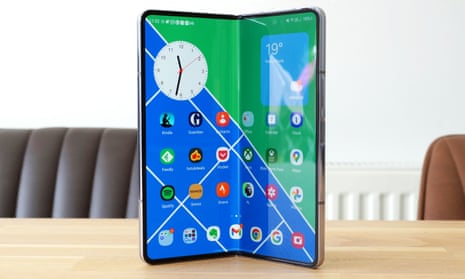 Samsung Galaxy Z Fold 5 review stood up on a desk with the screen partially folded.