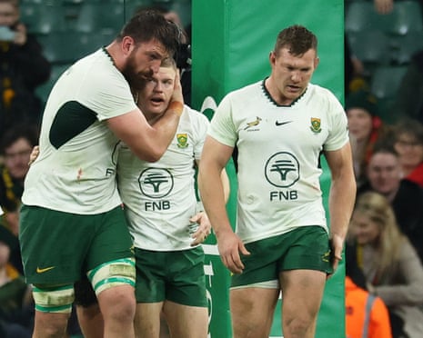 South Africa’s Morne van den Berg (centre) celebrates scoring their fourth try with teammates.
