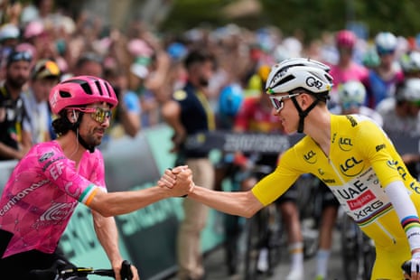 Tadej Pogacar shakes hands with Ben Healy.
