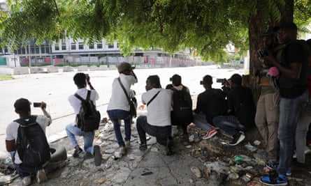 Line of journalists with cameras seen from behind