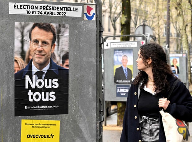 A campaign poster of the French president Emmanuel Macron on a street in Paris.