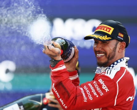 Hamilton sprays champagne in celebration