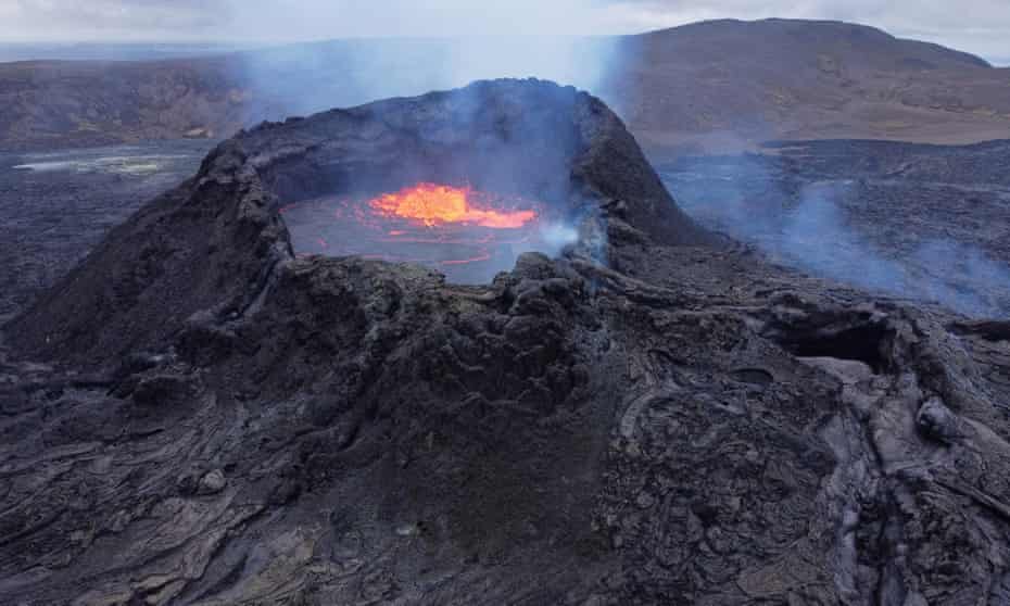 Iceland Undergoes Change From Impact Of Global Warming<br>GRINDAVIK, ICELAND - AUGUST 19: In this aerial view, molten lava churns in the mouth of the Fargradalsfjall volcano on August 19, 2021 near Grindavik, Iceland. Iceland is feeling a strong impact from global warming. While the volcano, which erupted in March of this year, lies in the volcanic lowlands southwest of Reykjavik, other Icelandic volcanoes lie under the island's large ice caps, such Eyjafjallajokull, which erupted in 2010. Since the 1990's 90% of Iceland's glaciers have been retreating and projections for the future show a continued and strong retreat in size of its three ice caps. The reduction in mass and pressure from the melting ice caps is increasing the likelihood of further seismic and volcanic activity. (Photo by Sean Gallup/Getty Images)