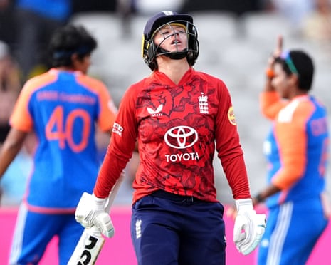 England's Danni Wyatt-Hodge walks aft losing her wicket to India's Shree Charani.