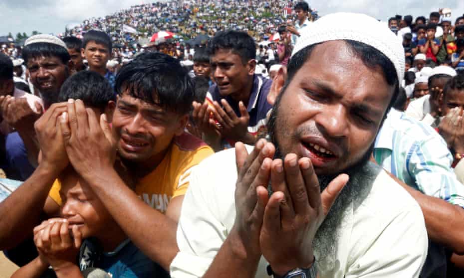 Rohingya refugees in Bangladesh take part in prayers to mark the second anniversary of their exodus from Myanmar