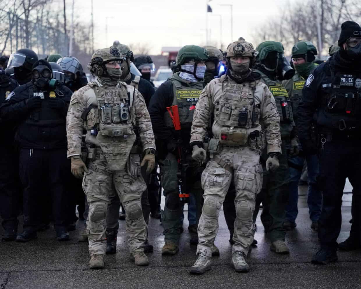 Ongoing federal immigration crackdown in MinneapolisMembers of U.S. Customs and Border Protection (CBP) and other law enforcement officials stand guard, in front of the Bishop Henry Whipple Federal Building, during a protest more than a week after an ICE agent fatally shot Renee Nicole Good, in Minneapolis, Minnesota, U.S., January 17, 2026. REUTERS/Seth Herald