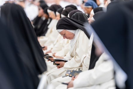 Nuns pray during the mass