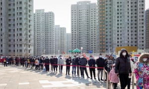 Residents line up to undergo a Covid-19 test in Tianjin, China, on 9 January.