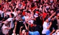 England fans at Wembley BoxPark celebrate the Euro 2024 semi-final victory against the Netherlands.