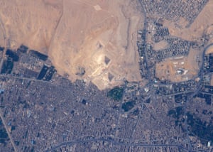 El Giza, Egypt You can’t see the pyramids with the naked eye from space but this is the view through an 800 mm lens.’ The three pyramids in the centre of this photo (from largest to smallest, and from closest to the city to the desert) are: The Great Pyramid at Giza (the oldest of the Seven Wonders of the Ancient World), the Pyramid of Khafre and the Pyramid of Menkaure.