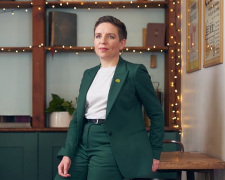 Carla Denyer in a green trouser suit