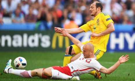 Roman Zozulya is tackled during Ukraine and Poland’s Euro 2016 group game.