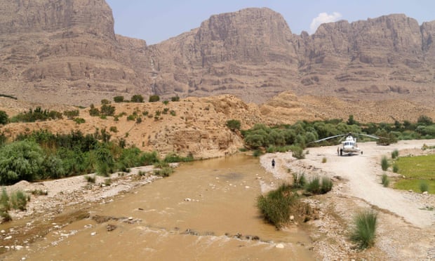 Helicopter next to a river in Iran.