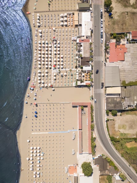An aerial view of the coastline, showing that most of it is taken up with private beaches