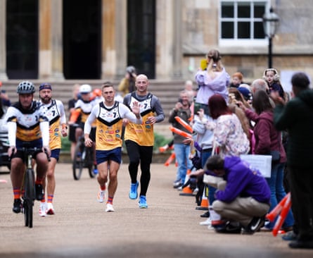 Kevin Sinfield (centre) runs with the England head coach, Steve Borthwick (right), on day three of the 7 in 7: The Grand Finale 2026 Challenge