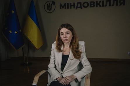 Svitlana Hrynchuk in an office.