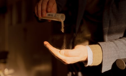 Pete Rowe pours engineered protein from a tube