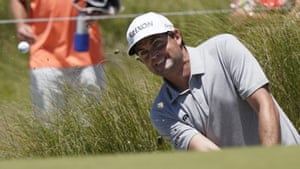 Keegan Bradley chips to the 18th green.
