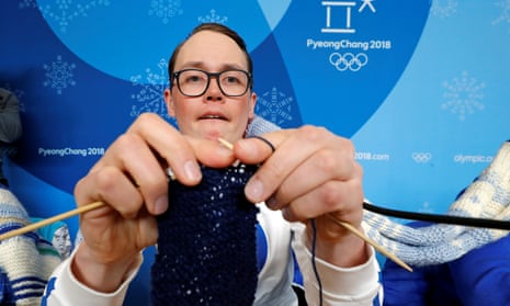Antti Koskinen, snowboard head coach, shows off his knitting skills in Pyeongchang