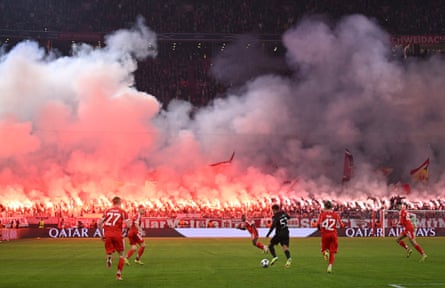 Bayern Munich fans light up their team ‘s victory against Sprting Lisbon with flares and banners.