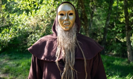 A person wearing a golden mask in The Traitors
