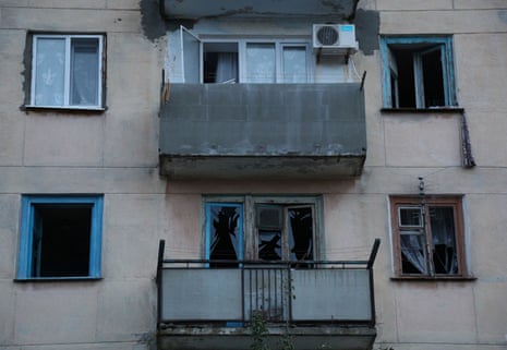 A view shows a residential building with windows broken as a result of explosions at a Russian military airbase, in Novofedorivka, Crimea.