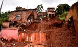 Damages after a landslide in Vila Bernadete, Belo Horizonte, Minas Gerais state, Brazil on Sunday.