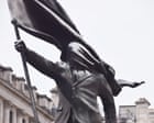 Banksy signature on London statue of man marching blinded by flag