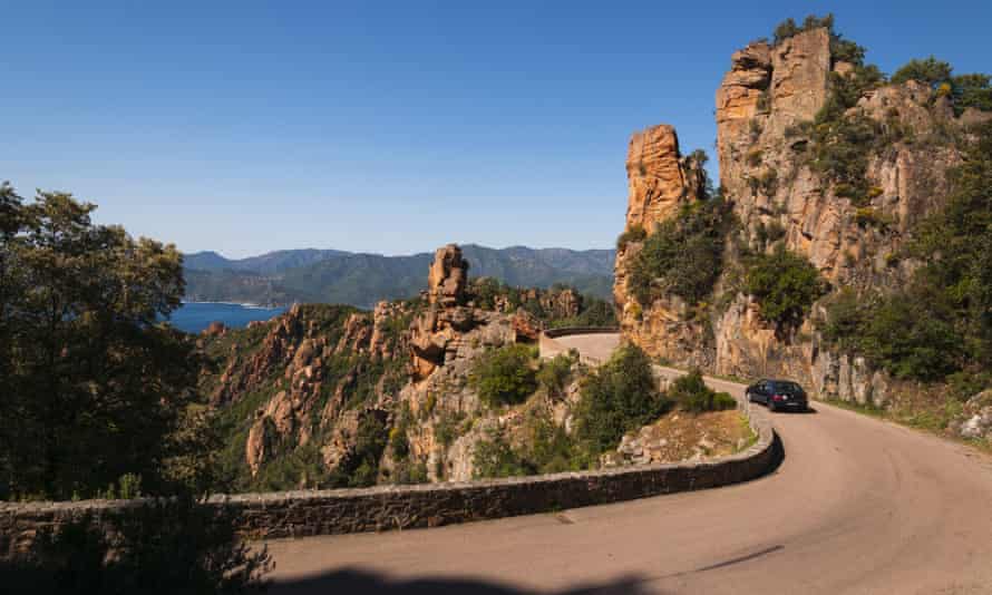 A road passes through the Calanques de Piana between Ajaccio and Calvi.