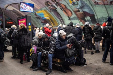 A group of people takesshelter in a metro station during an air raid alarm in Kyiv, Ukraine, on Wednesday.