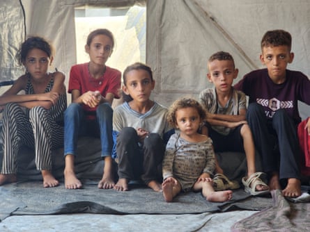 Seven Khalidi children, all looking emaciated