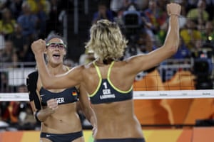 Germany’s Kira Walkenhorst, right, and Laura Ludwig celebrate against Brazil during the women’s beach volleyball gold medal match.