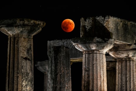 The full moon sits over the temple of Apollo in Corinth, Greece.