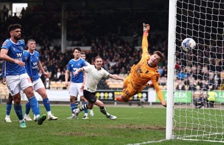Ben Waine beats Melker Ellborg to score Port Vale’s winner.